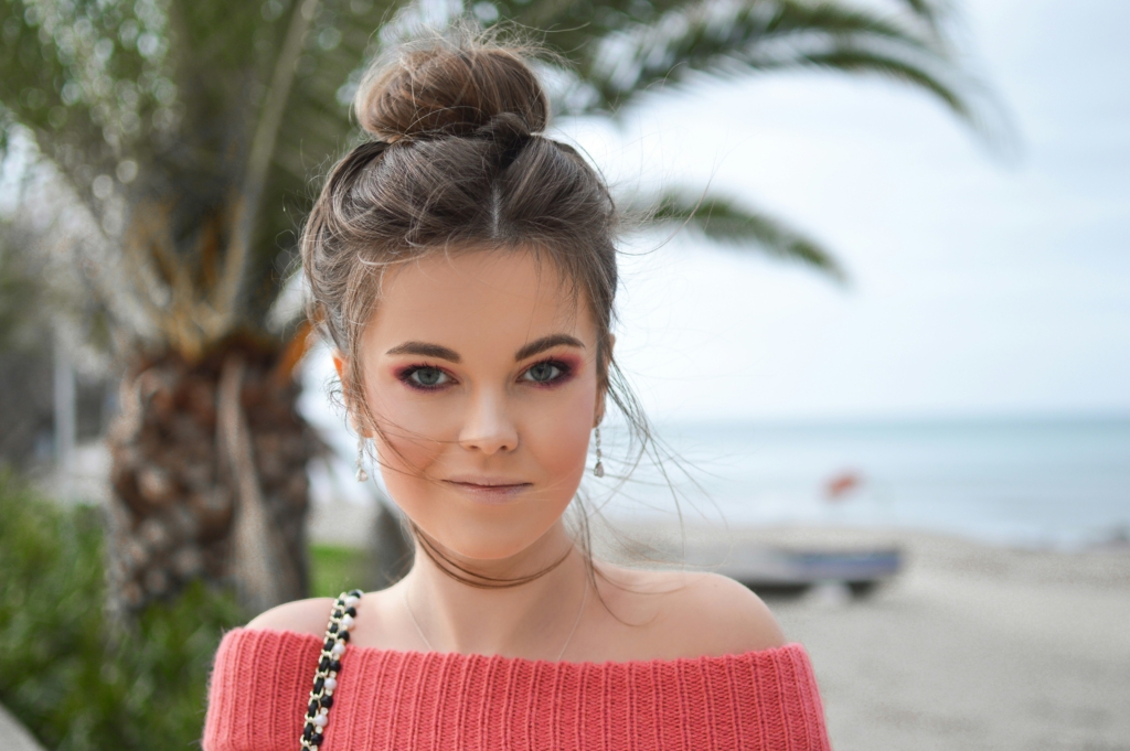 woman with bun in her hair beach wave hair beach hairstyles that last