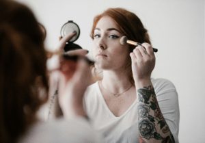 clean beauty myths - woman doing her makeup