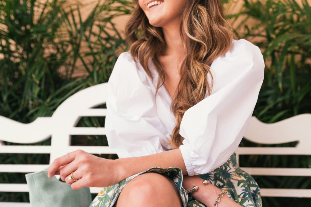 summer capsule wardrobe - woman in white top