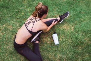 Elevated Athleisure Outfits - woman stretching before exercise
