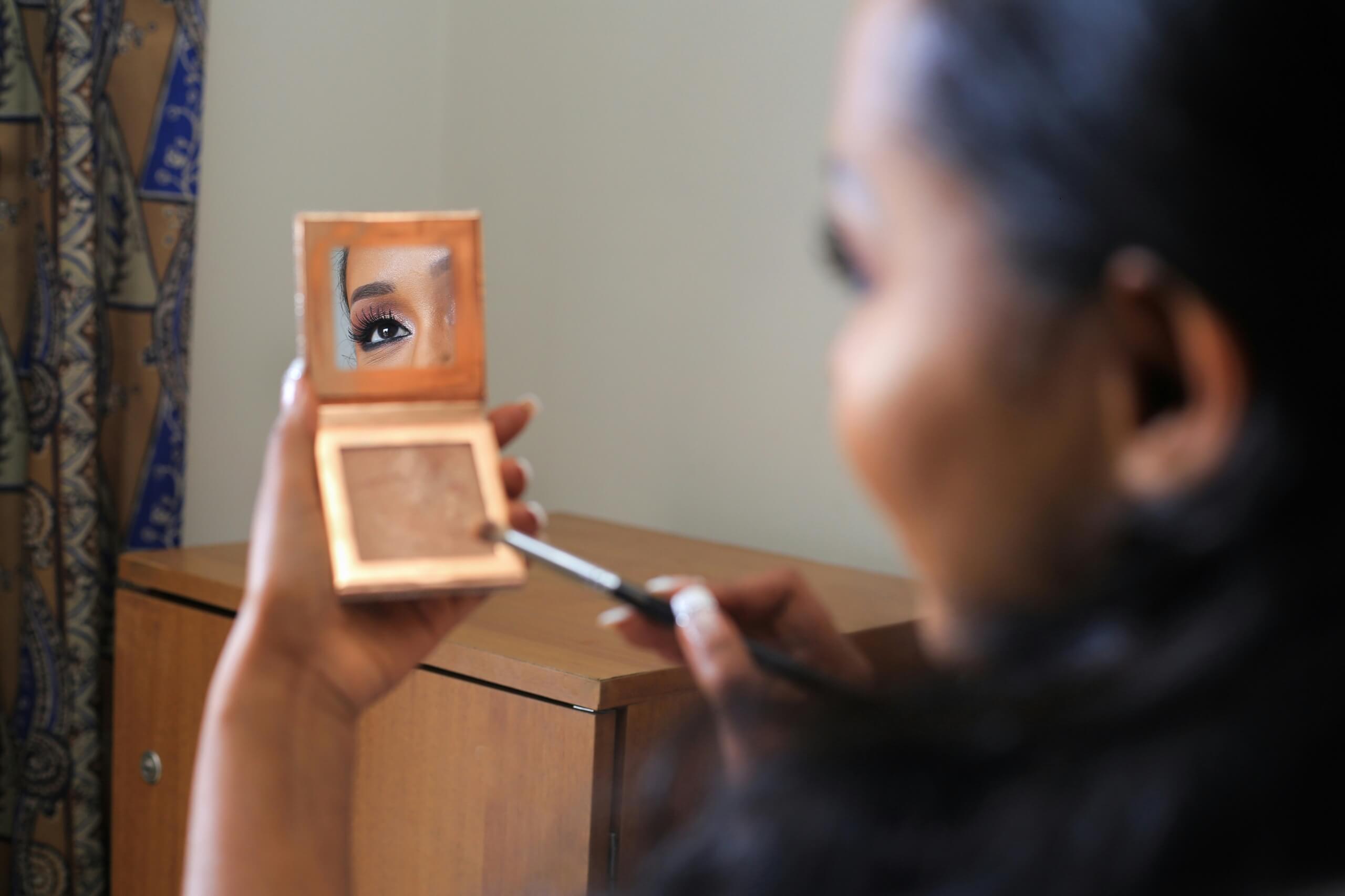 clean beauty myths - woman doing makeup
