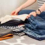 Capsule Wardrobe for Back-to-School - woman folding clothing