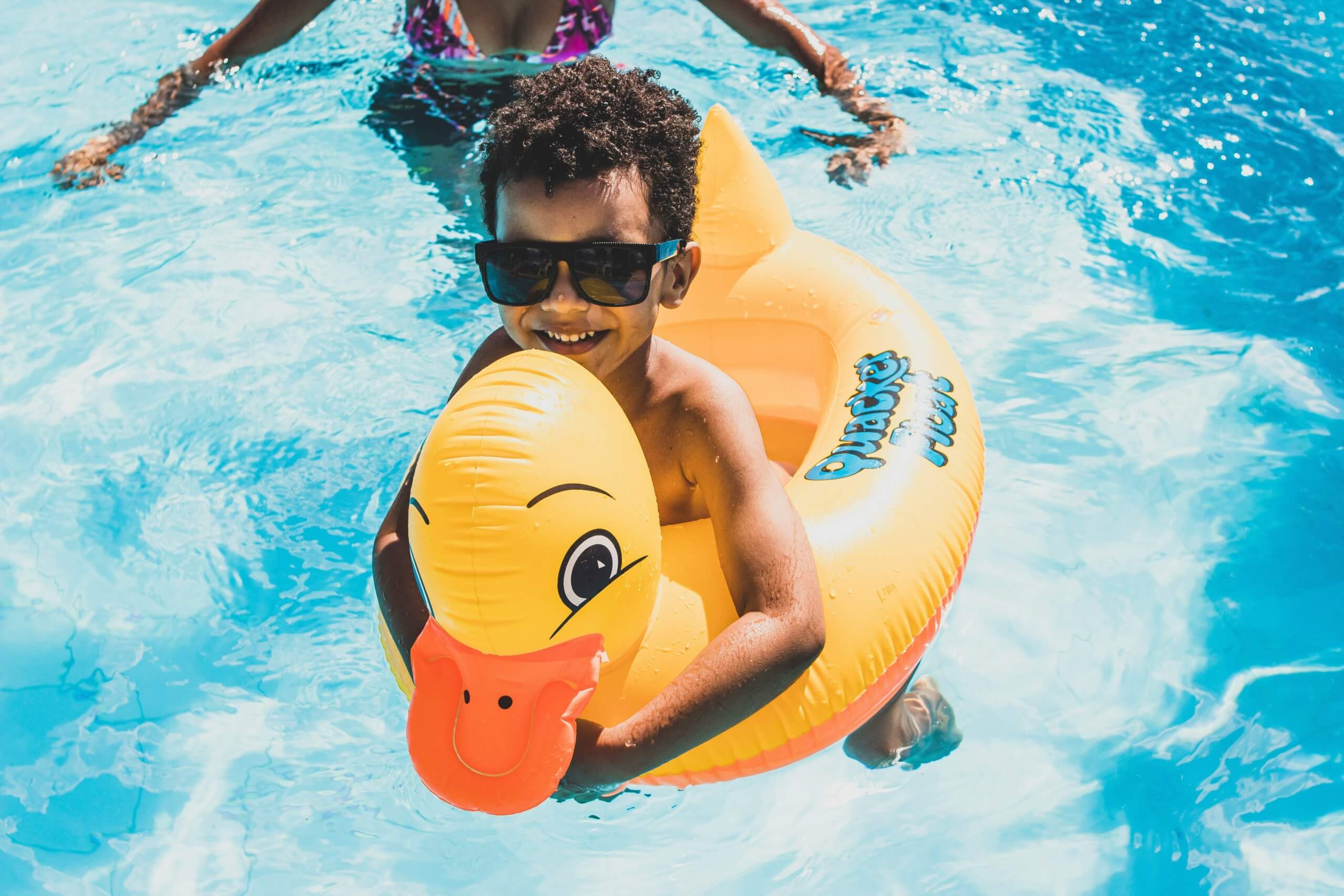 hotels with pools - kid in pool