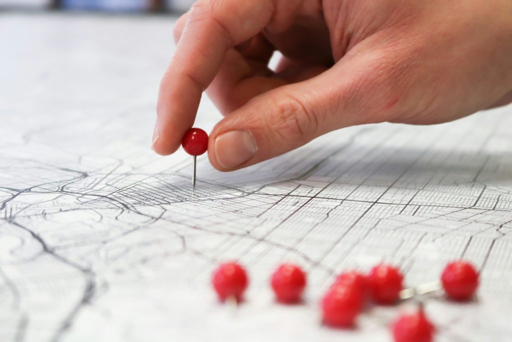 solo trips for women - map family road trip tips