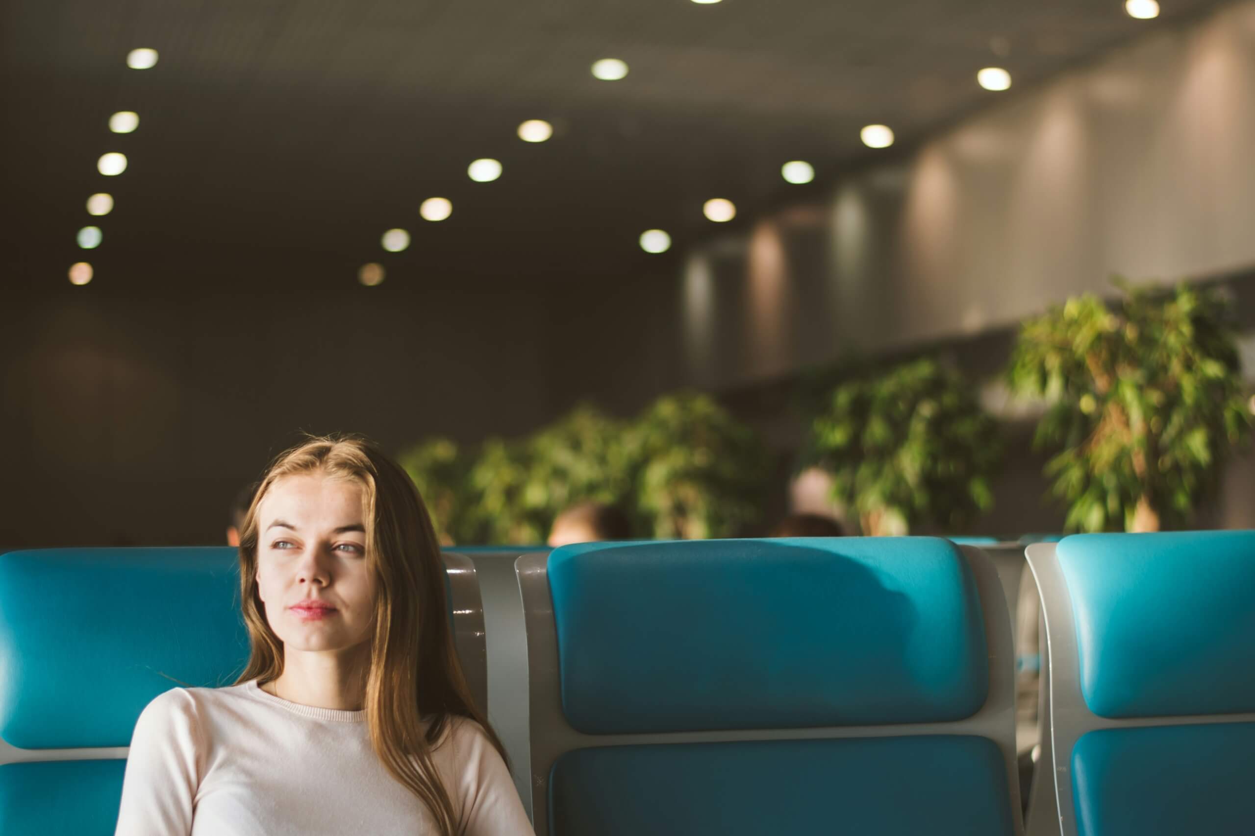 woman in airport - long-term travel
