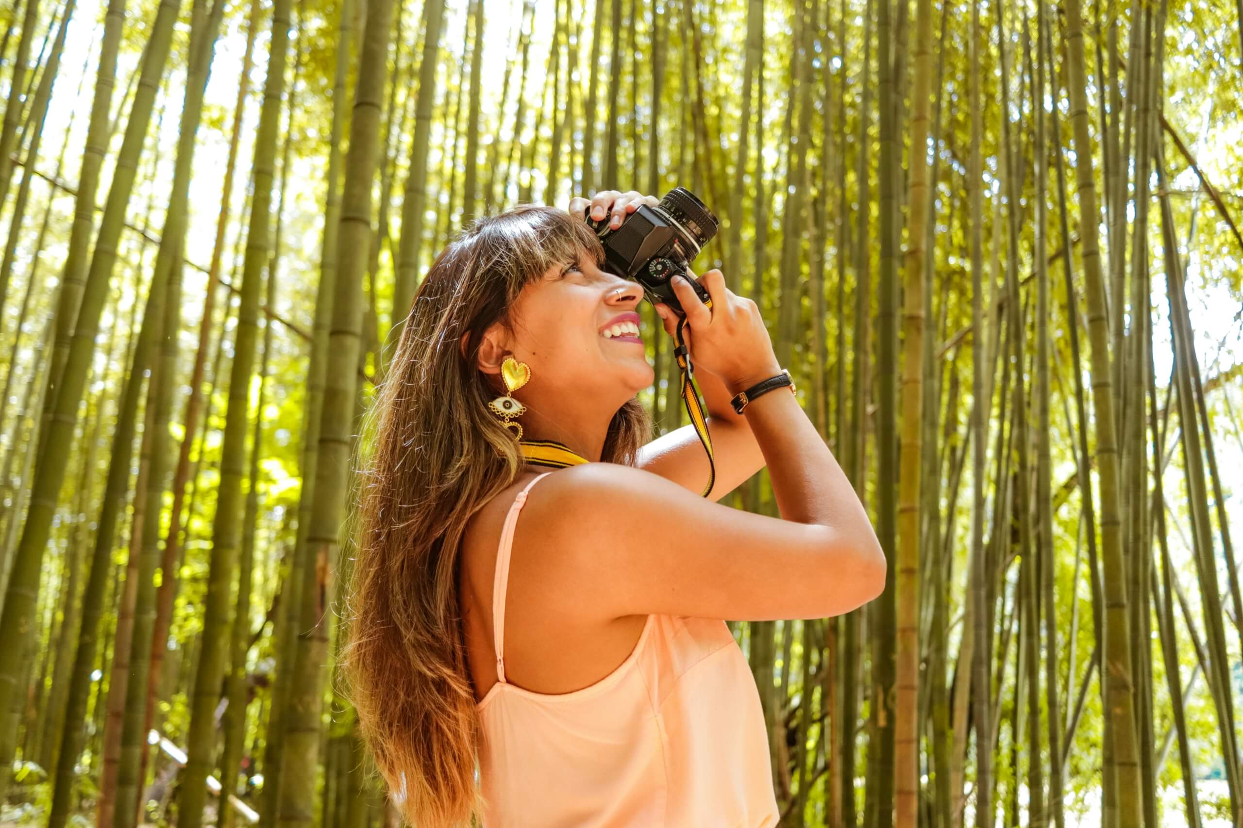 woman taking a picture - long-term travel