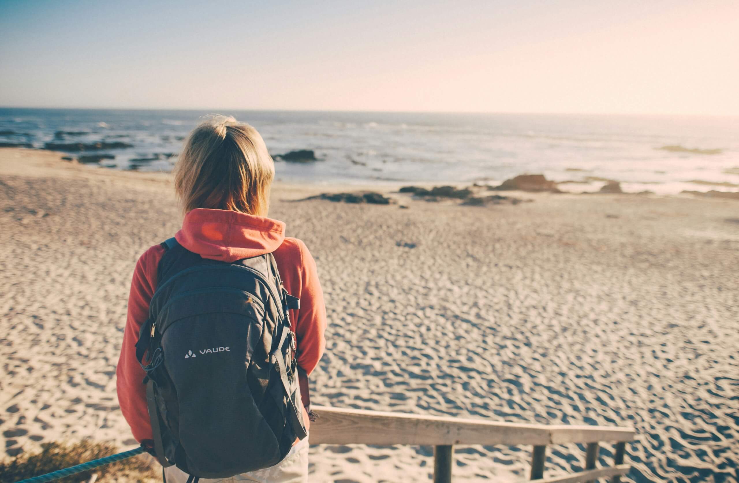woman on the beach - long-term travel