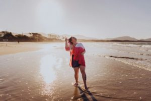 woman on the beach - fall beach trips