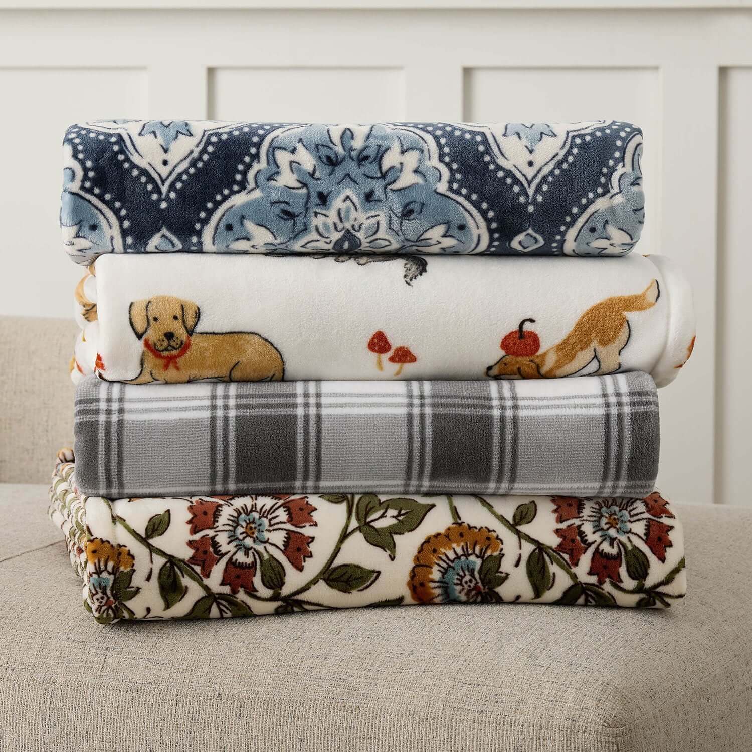 stack of blankets fall throws and pillows