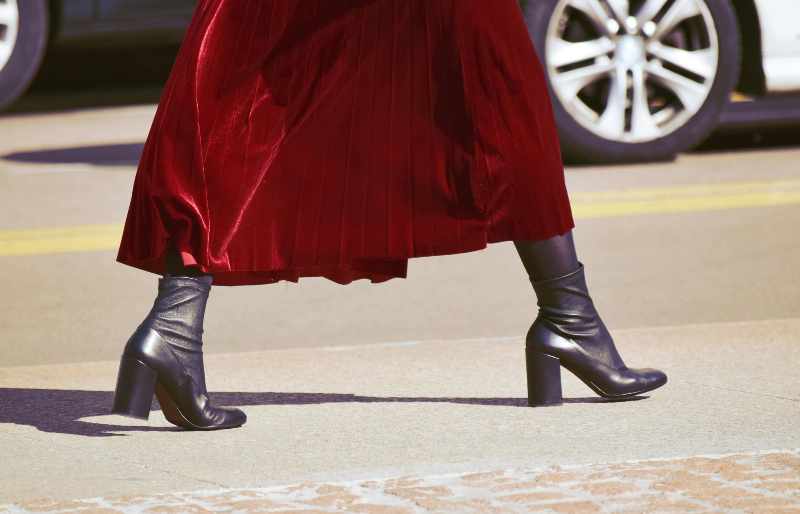 woman in chunky heel boots walking trending shoe styles 