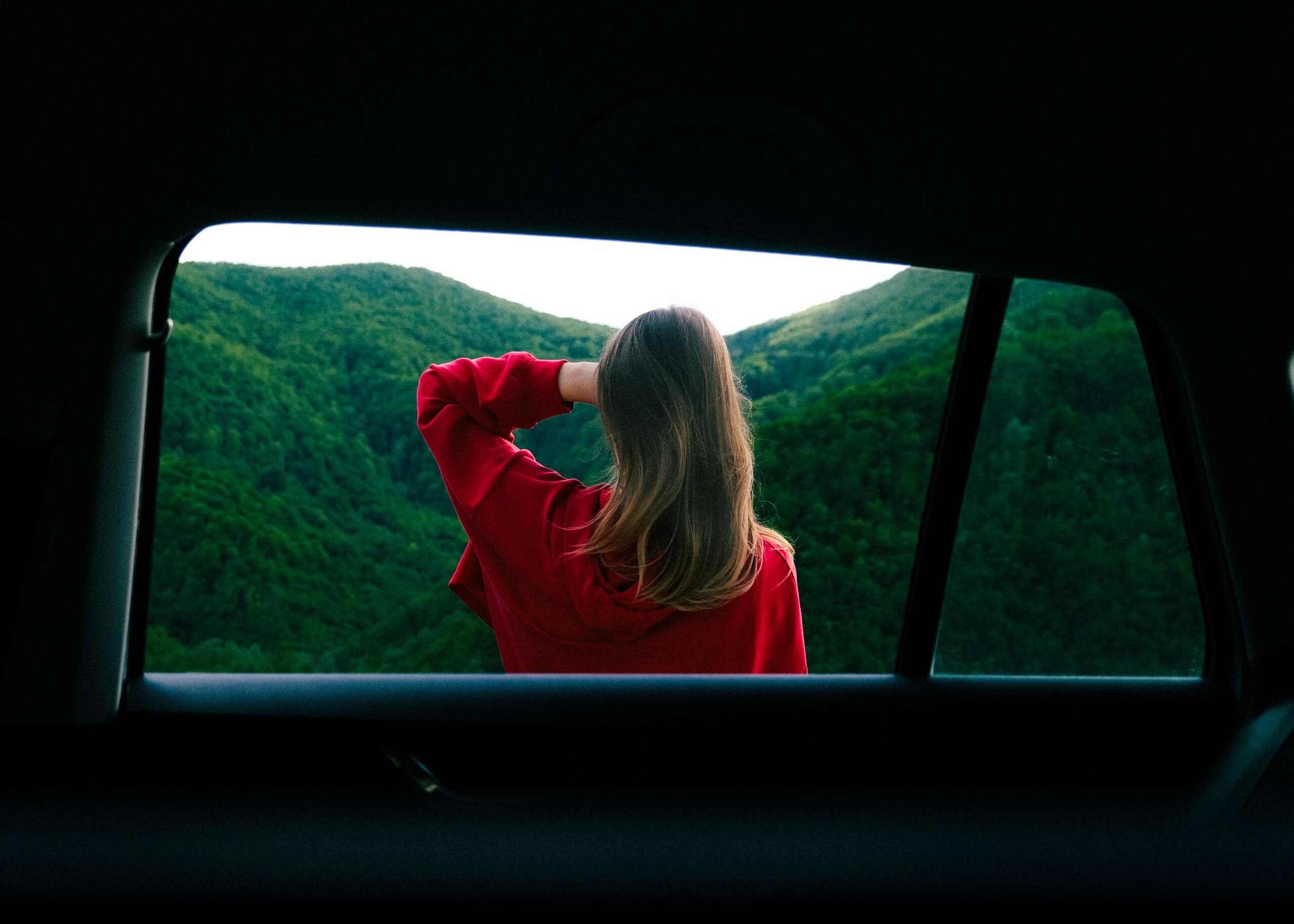 woman traveling looking outside camping hiking travel tuesday