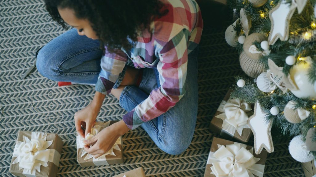 gifts for the homebody who loves to relax woman wrapping presents