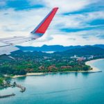 Last-Minute Holiday Travel Deals airplane travel on a plane