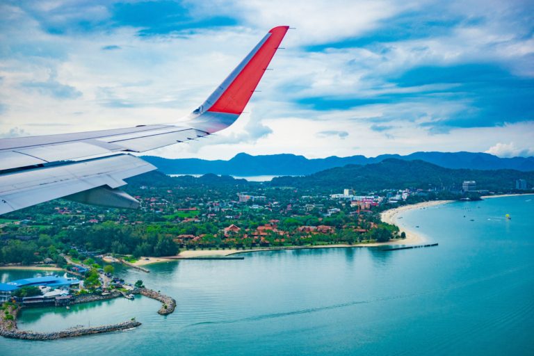 Last-Minute Holiday Travel Deals airplane travel on a plane