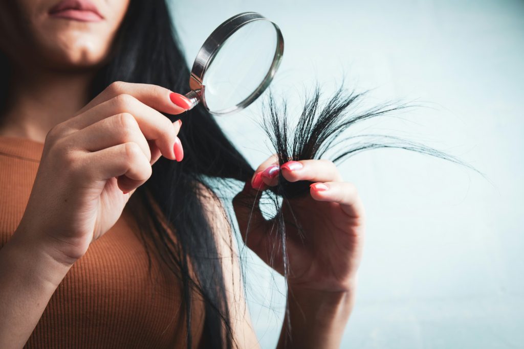 woman studying her hair